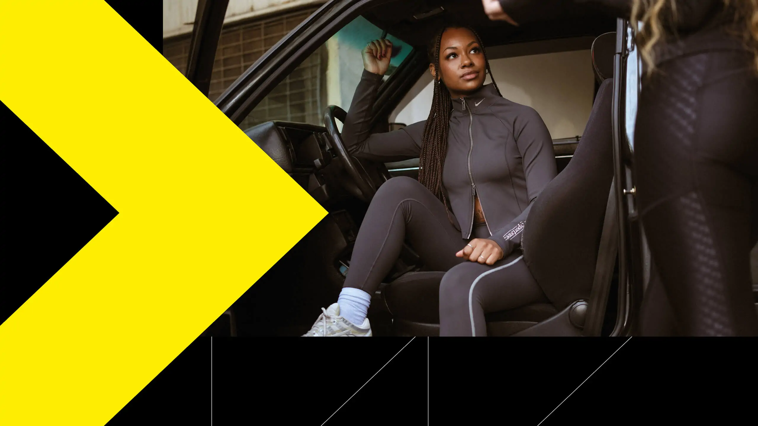JD Sports image with girl in tracksuit and trainers